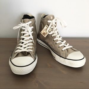 Metallic Converse high tops.